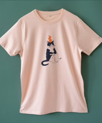Orange Cat t-shirt | Hand screen printed illustration of a cat balancing oranges on misty pink organic cotton tee with navy and orange