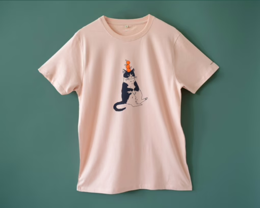 Orange Cat t-shirt | Hand screen printed illustration of a cat balancing oranges on misty pink organic cotton tee with navy and orange