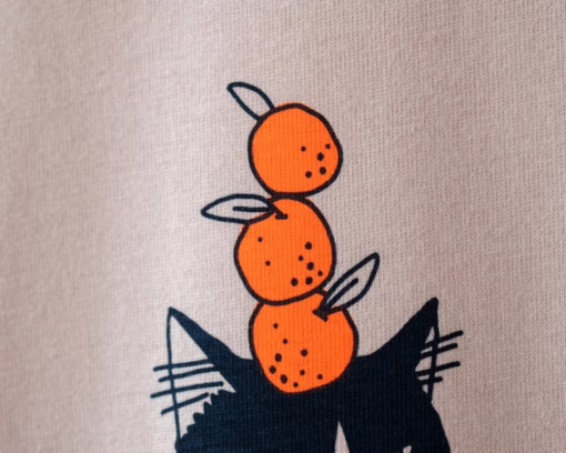Orange Cat t-shirt | Hand screen printed illustration of a cat balancing oranges on misty pink organic cotton tee with navy and orange