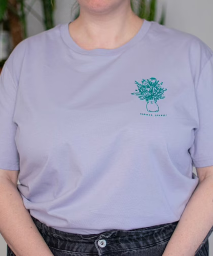 Summer Bouquet T-Shirt | Hand screen printed illustration of 7 cats with flowercrowns and other plants in green on lilac organic cotton tee