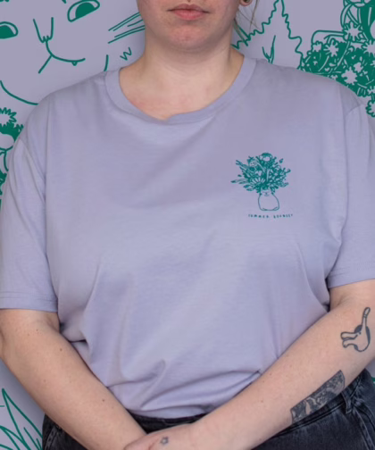 Summer Bouquet T-Shirt | Hand screen printed illustration of 7 cats with flowercrowns and other plants in green on lilac organic cotton tee